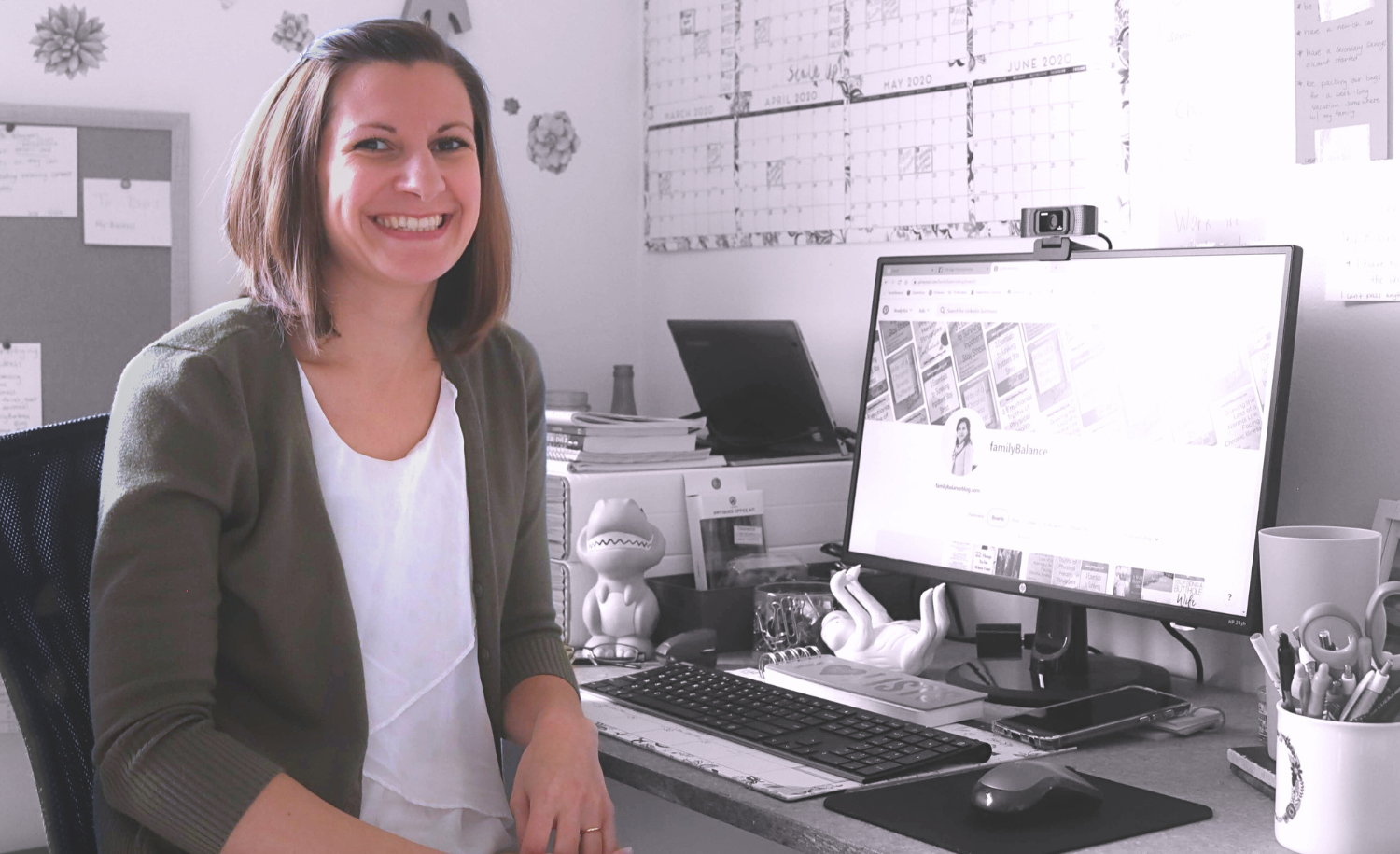 woman smiling at computer home office